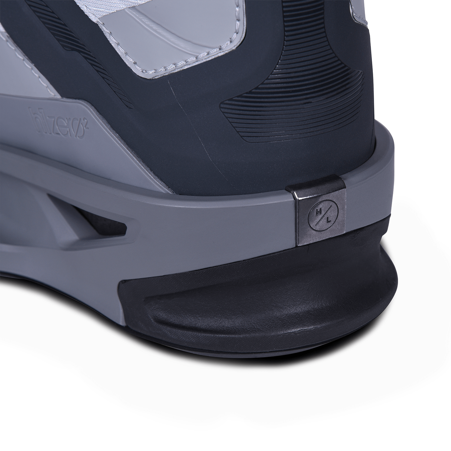 Close-up of a grey and black roller skate heel with size adjustment dial.